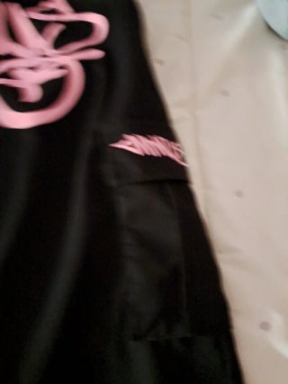 Pantalones  negros con detalles rosas