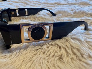 Gafas de sol Versace negras y doradas
