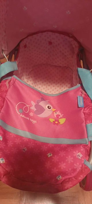 Silla de muñecas rosa con capota