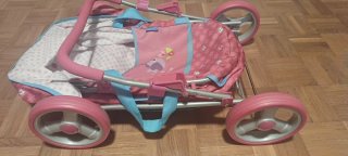 Silla de muñecas rosa con capota
