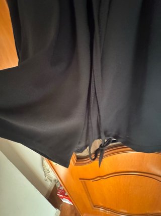 Tuta corta nera con zip