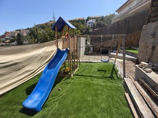 Parque infantil Wickey con columpio y tobogán