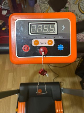 Cinta de correr plegable, naranja y negra.