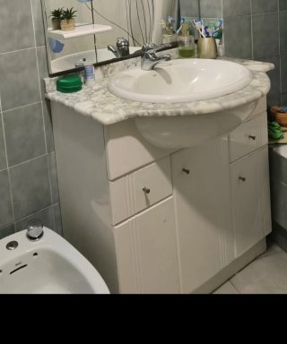 Mueble de baño con lavabo de mármol