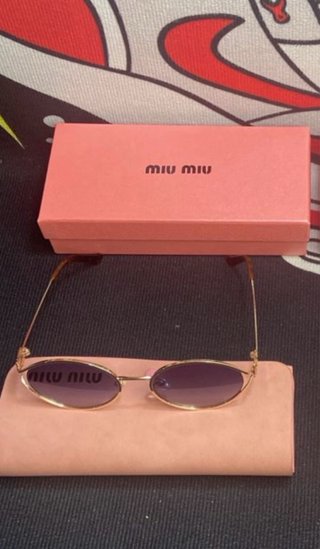 Gafas Miu Miu Doradas