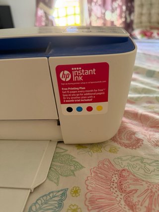Impresora HP azul y blanca
