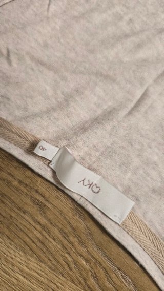 Camiseta OkY sin mangas beige con flecos