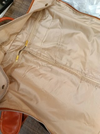 Bolsa de viaje multifunción beige y negra