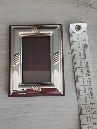 Cornice in argento