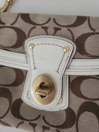Pochette Coach monogramma marrone e bianca