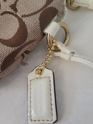 Pochette Coach monogramma marrone e bianca