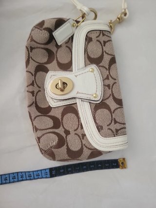 Pochette Coach monogramma marrone e bianca