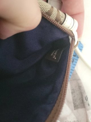 Pochette Coach monogramma marrone e bianca