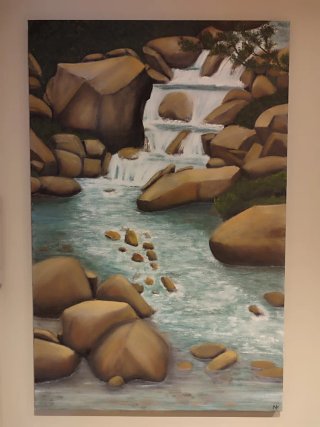 Cuadro al óleo de cascada y rocas