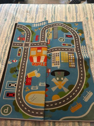 Alfombra infantil ciudad multicolor .