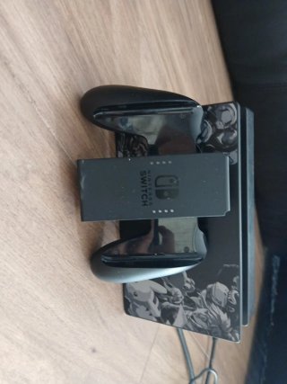 Nintendo Switch con mando y adaptador