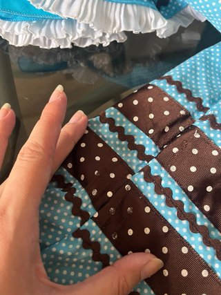 Traje de flamenca azul con detalles marrones