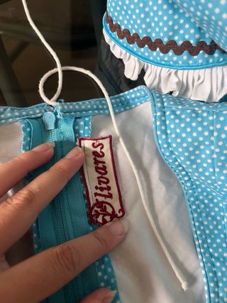 Traje de flamenca azul con detalles marrones
