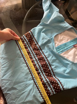 Traje de flamenca azul con detalles marrones