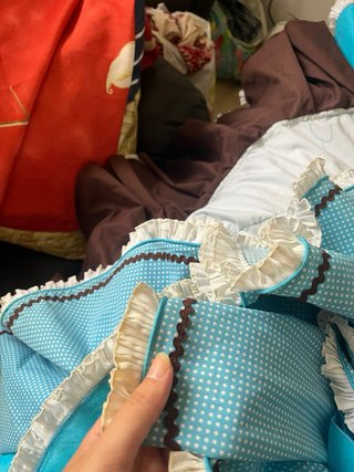 Traje de flamenca azul con detalles marrones