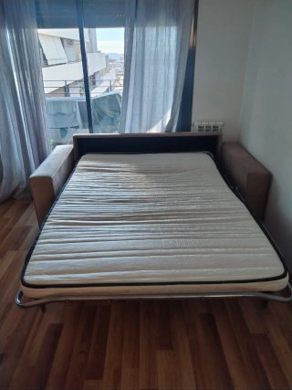 Sofá cama beige de tela
