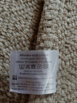 Alfombra tejida a mano beige y gris,