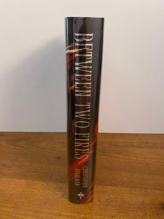 Between Two Fires Signed - Broken Binding