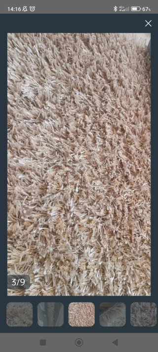 Alfombra beige de tintorería