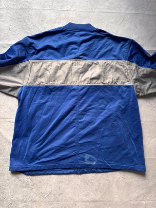 Chaqueta deportiva Starter azul y gris