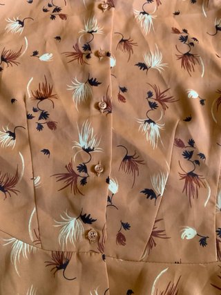 Bluse con peplo color rosa pesca floreale da donna