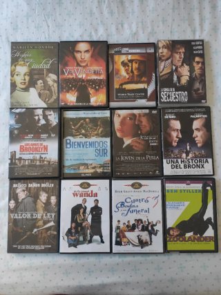 Lote  54 Películas Dvd + Reproductor portatil