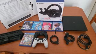 PS4 (PlayStation 4) Negra + Volante y Juegos