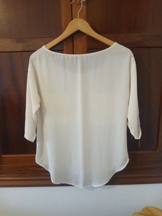 Blusa blanca manga 3/4 con bolsillos
