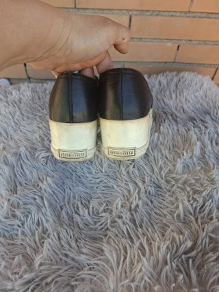 Mocassini Miu Miu neri con punta argento