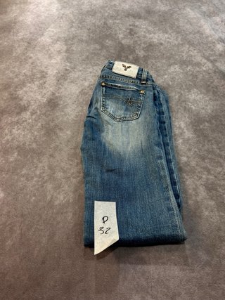Pantalones vaqueros campana desgastados