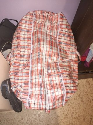 Saco grande de ropa de niño