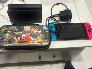 Nintendo Switch Azul/Rosa + Funda Mario Odyssey