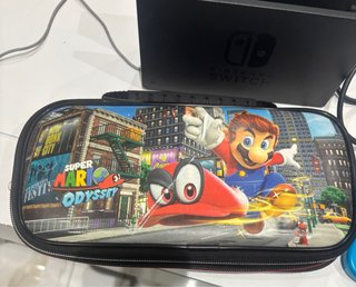 Nintendo Switch Azul/Rosa + Funda Mario Odyssey