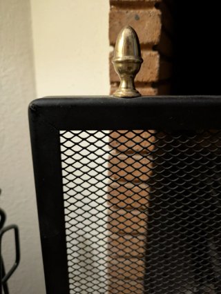 Rejilla para chimenea negra y dorada
