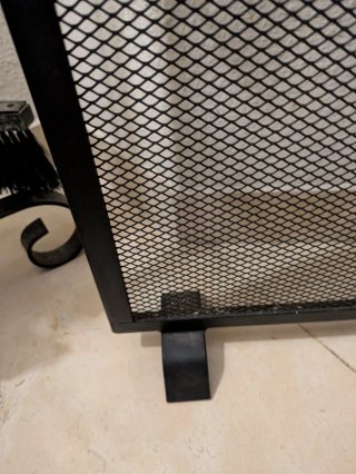 Rejilla para chimenea negra y dorada