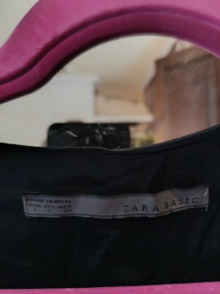 Chaleco Zara lentejuelas negro y plateado. S