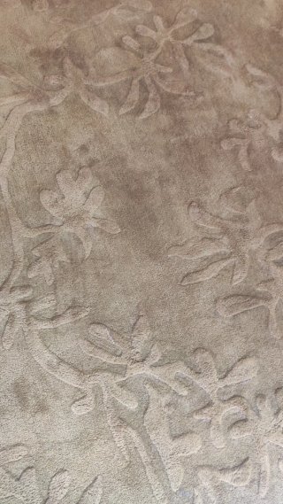 Alfombra de lana marrón