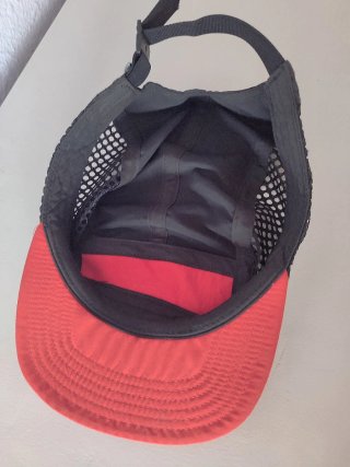 Gorra The North Face Negra y Naranja.