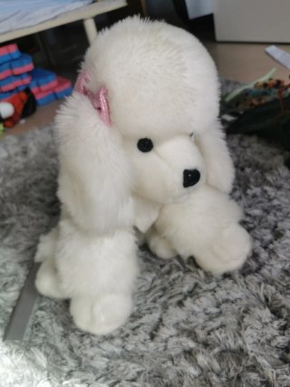 Peluche perro blanco con lazos rosas
