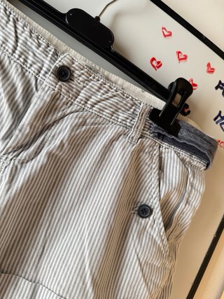 low rise blue and white railroad-striped shorts