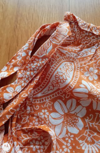 Pantalón corto estampado floral naranja