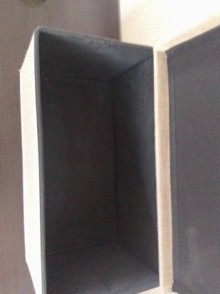 Caja plegable tela y madera.
