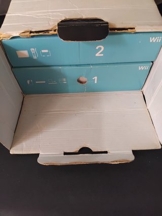 Nintendo Wii + Wii Sports + Wii Resort
