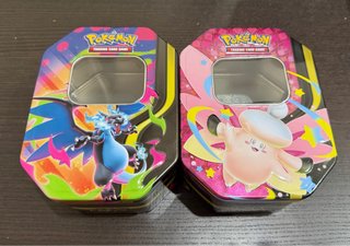 Latas Pokémon TCG Charizard y Clefairy