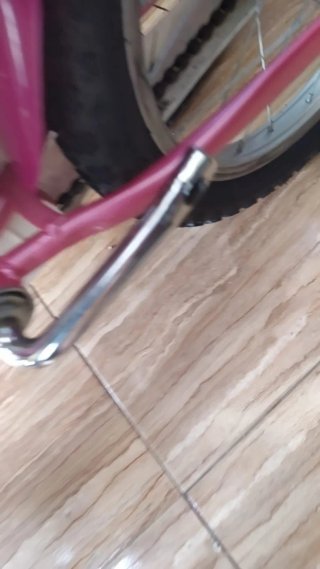 Bicicleta infantil rosa con asiento para muñecas